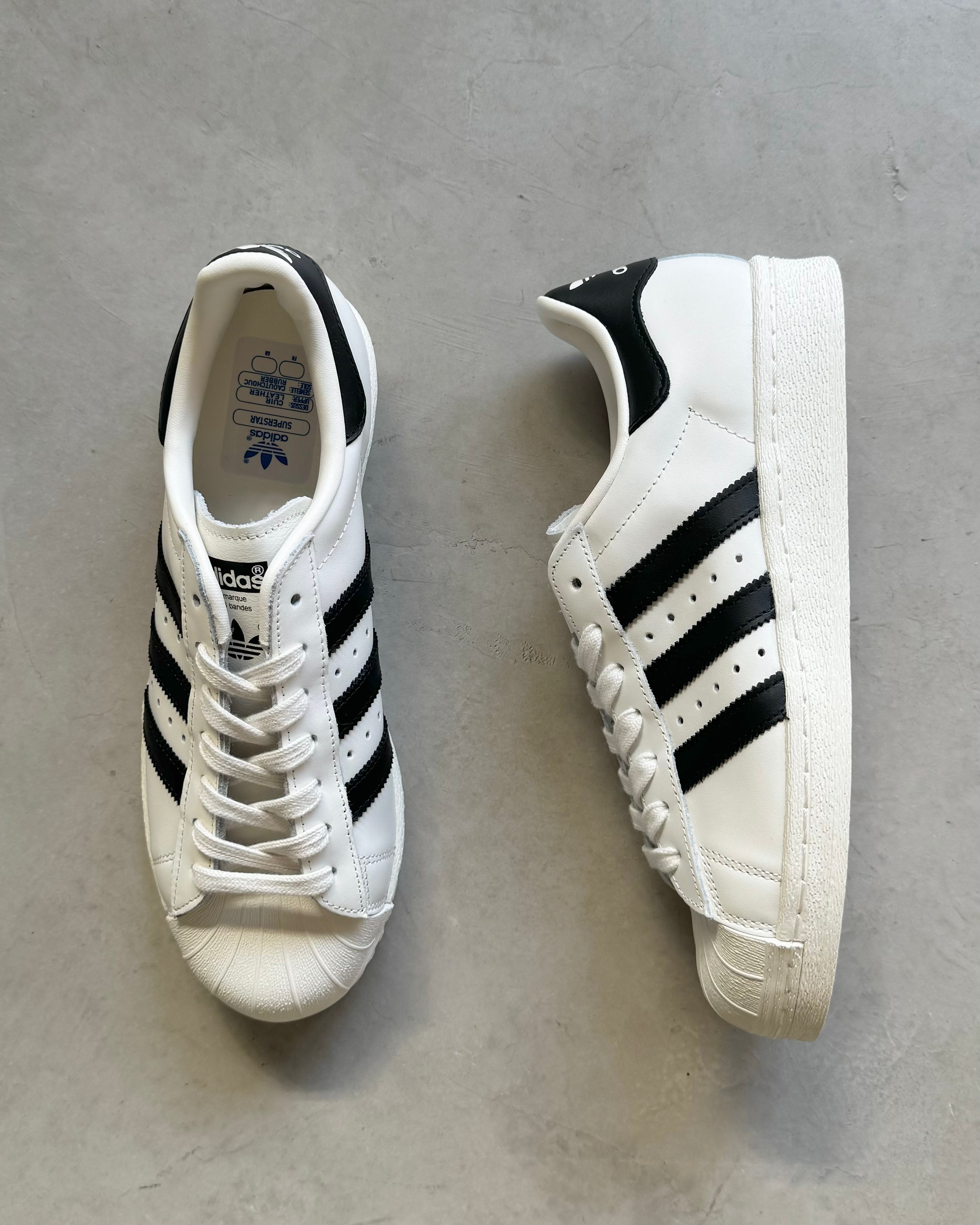 Adidas superstar shop black gold white
