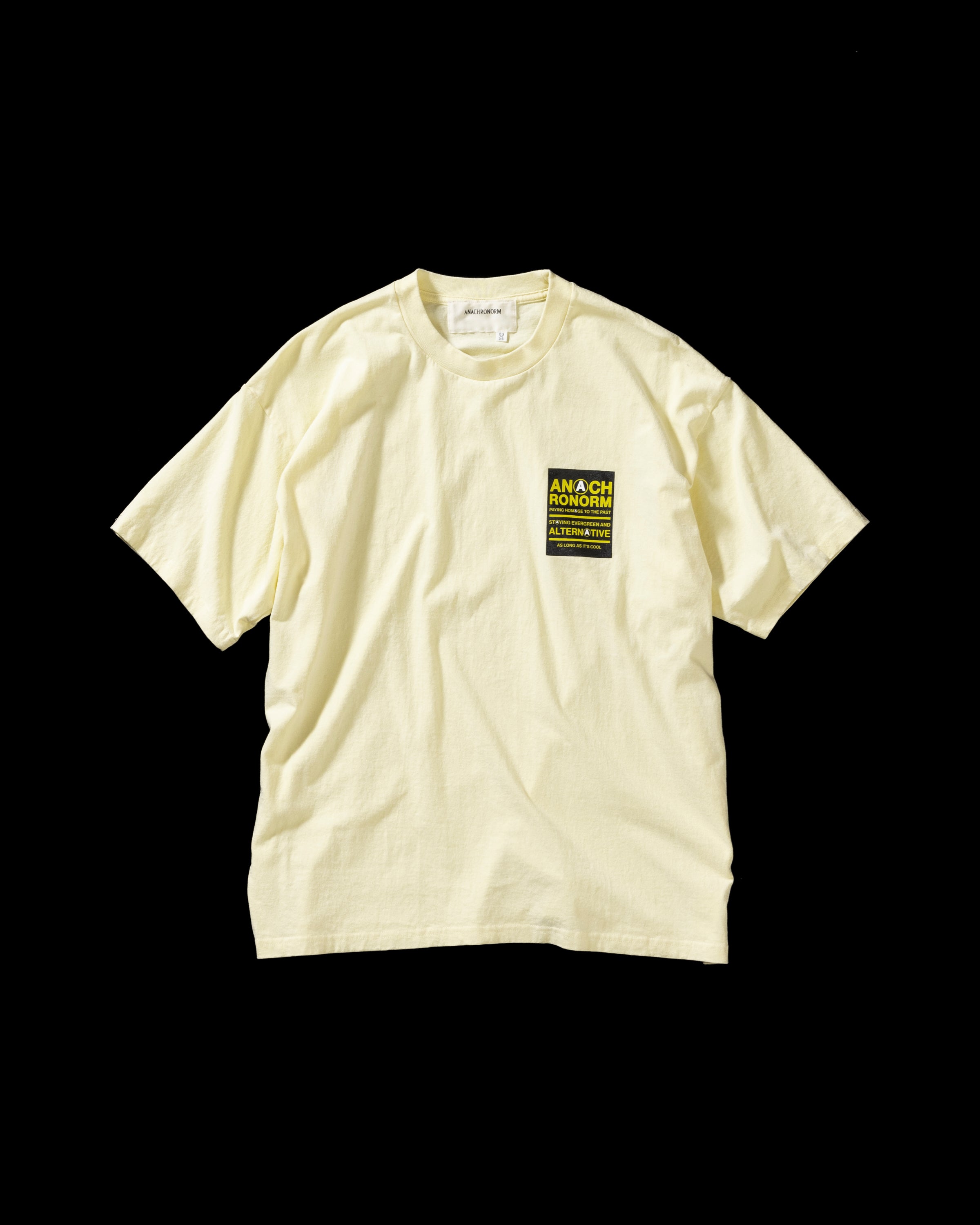 ANACHRONORM / STICKER MOTIF PRINTED S/S T-S - BEIGE