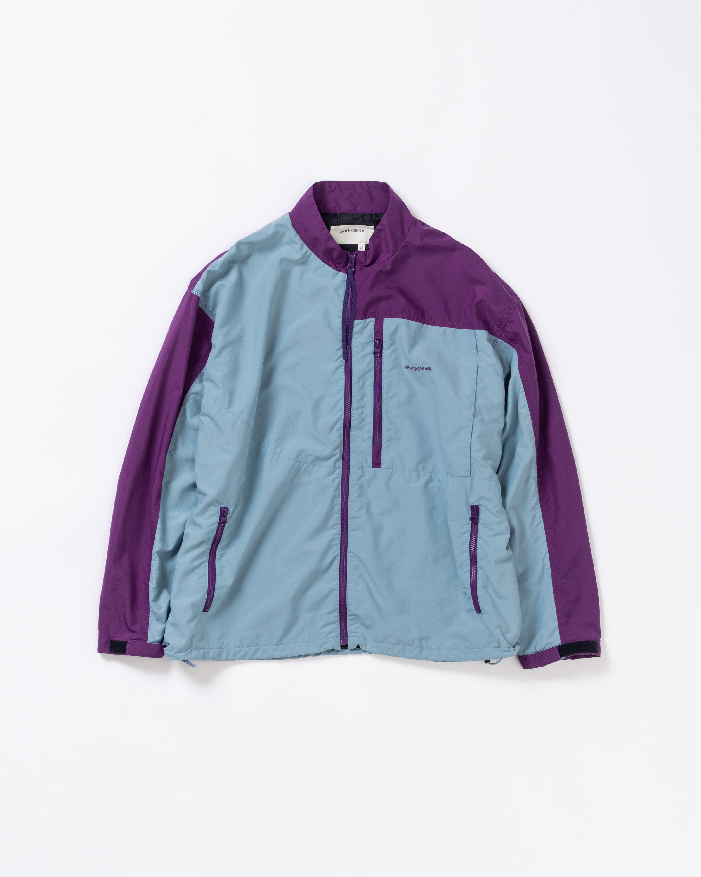ANACHRONORM / EXCHANGE PATTERN NYLON JACKET - SKY BLUE×PURPLE