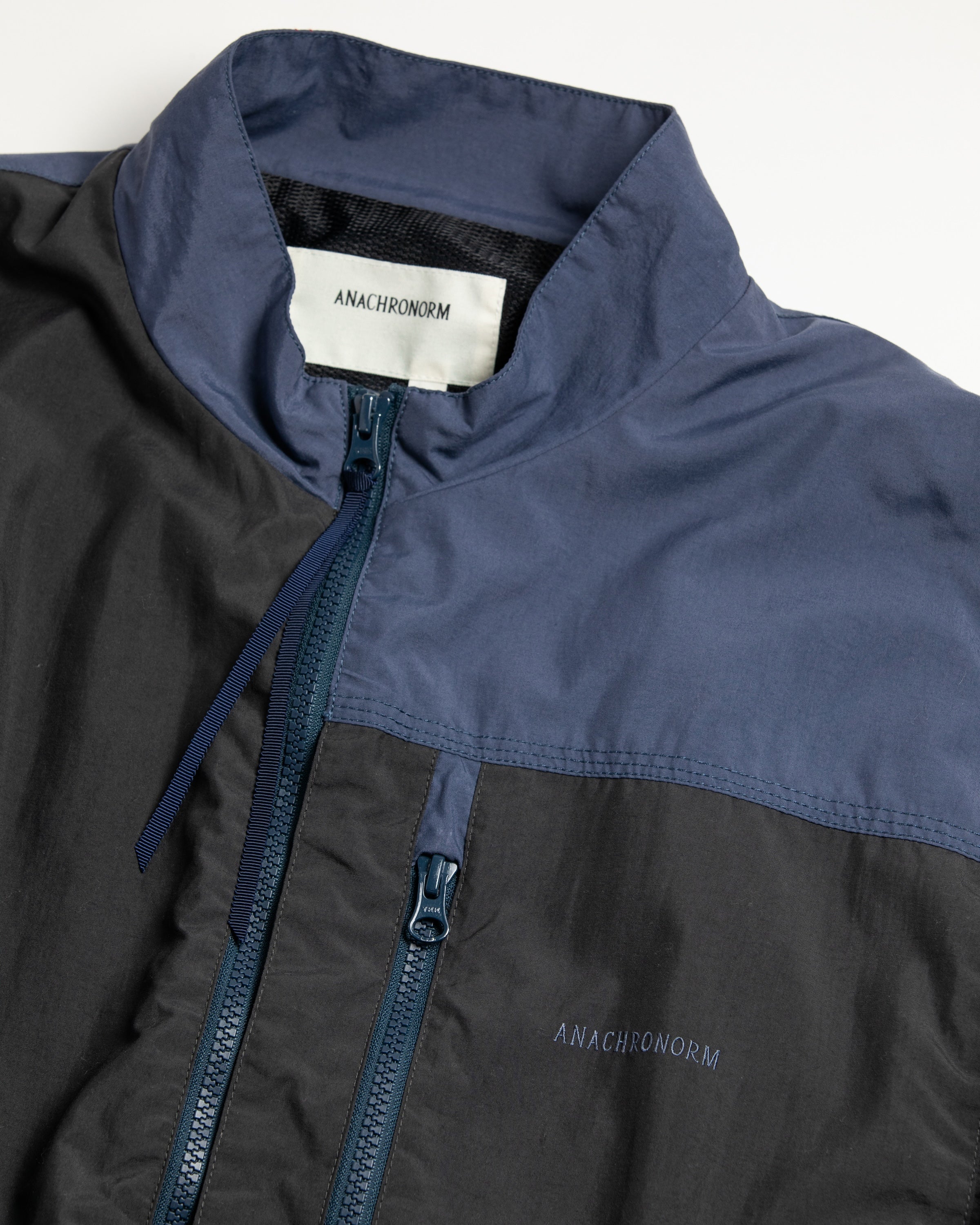 ANACHRONORM / EXCHANGE PATTERN NYLON JACKET - NAVY×BLACK