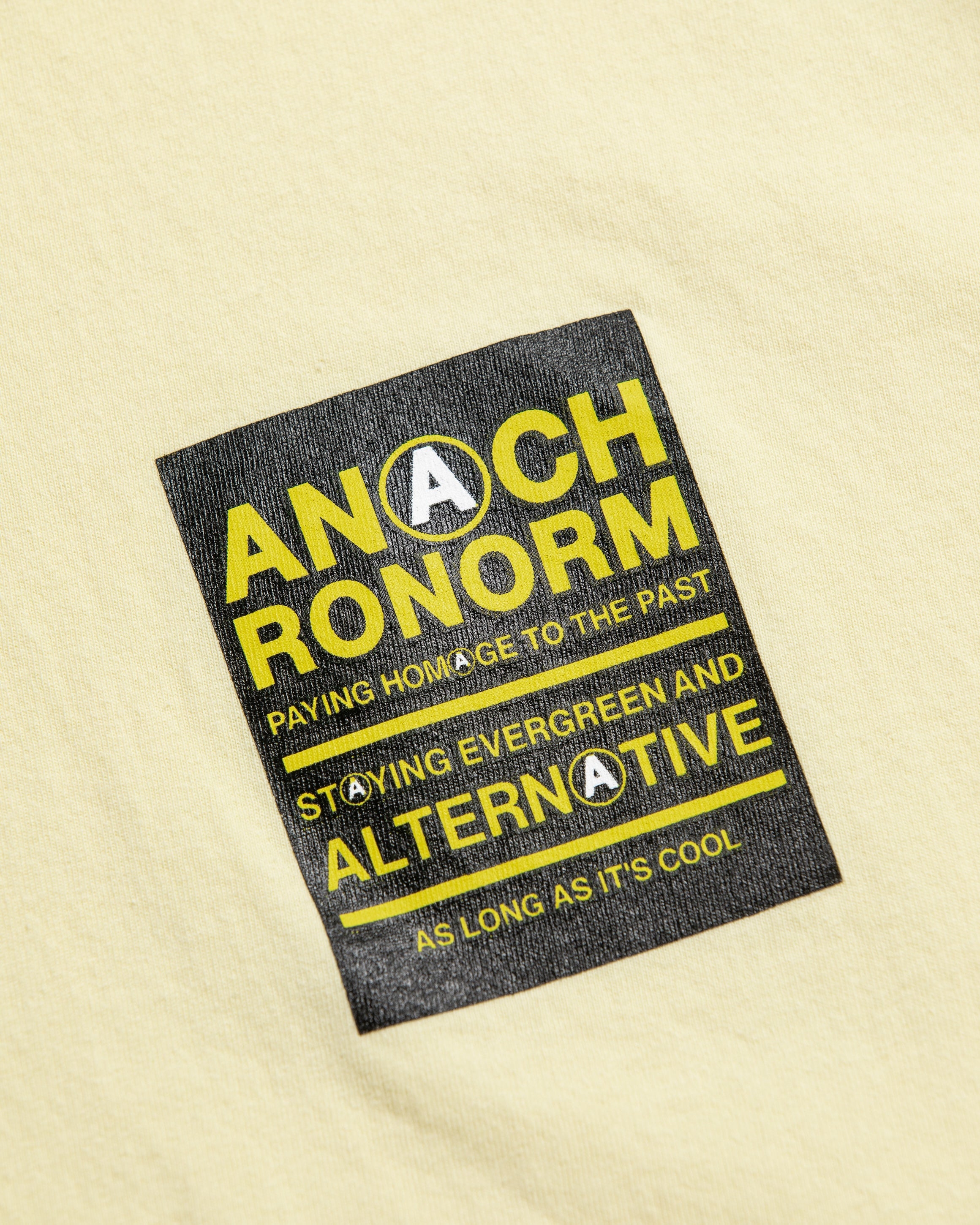 ANACHRONORM / STICKER MOTIF PRINTED S/S T-S - BEIGE