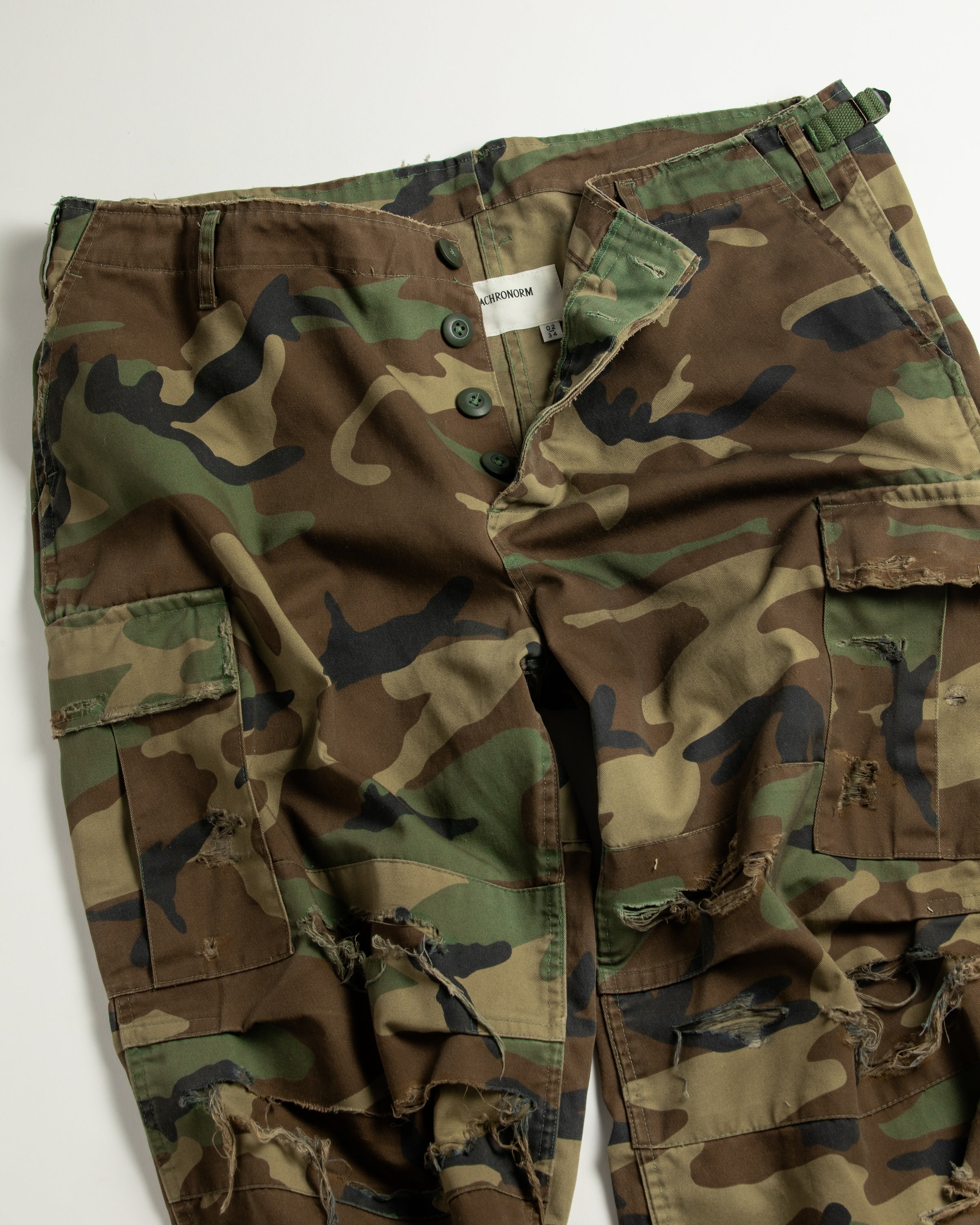 ANACHRONORM / CUT-OFF HARD DAMAGED B.D.U CAMO PANTS - WOODLAND
