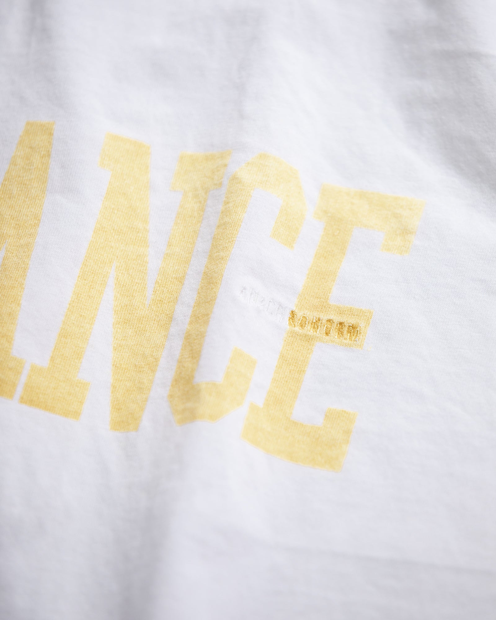 ANACHRONORM / BALANCE COLLEGE PRONTED S/S T-S - YELLOW PRINT